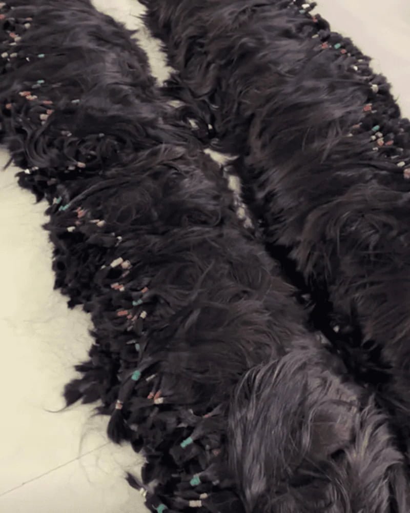 Raw virgin human hair bundles sorted by quality grade