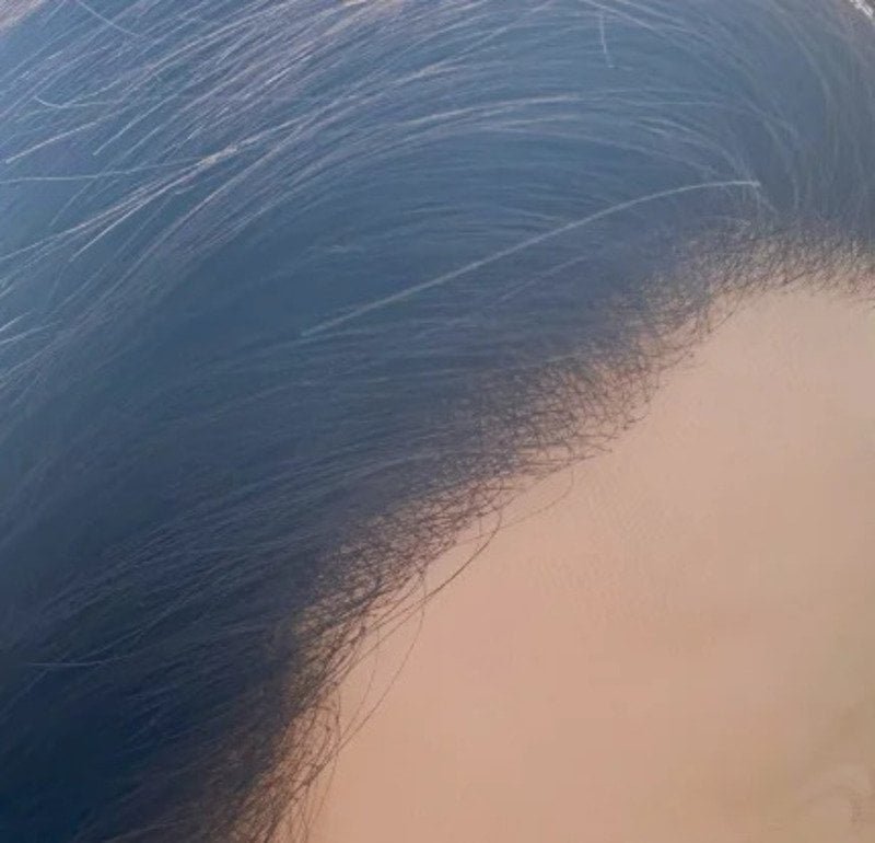 Invisible hairline showing natural scalp appearance with hand-tied knots