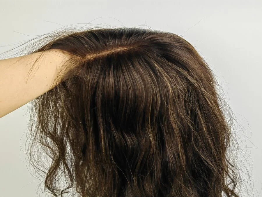 Ultra close-up of natural lace wig hairline showing bleached knots and realistic scalp