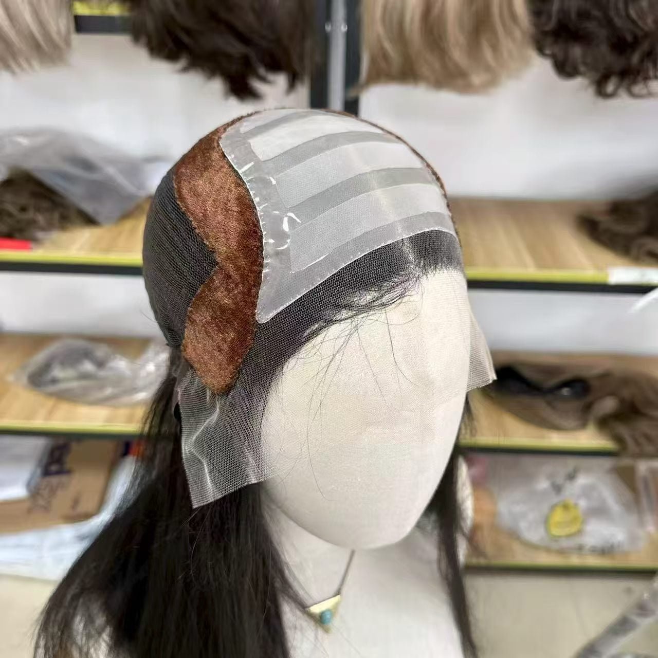 A close-up of a premium medical wig cap showing silicone strips and soft lining