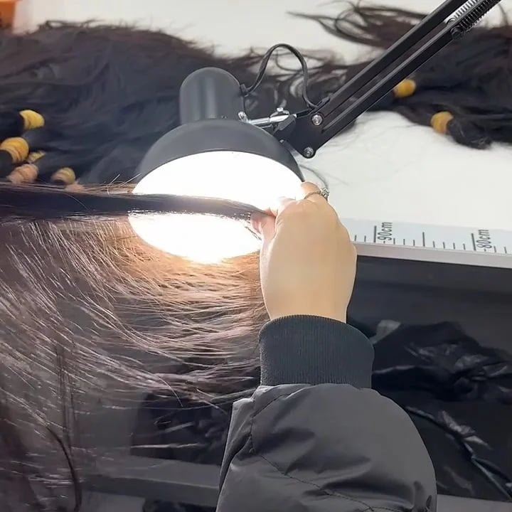 sorting raw virgin human hair at a premium factory