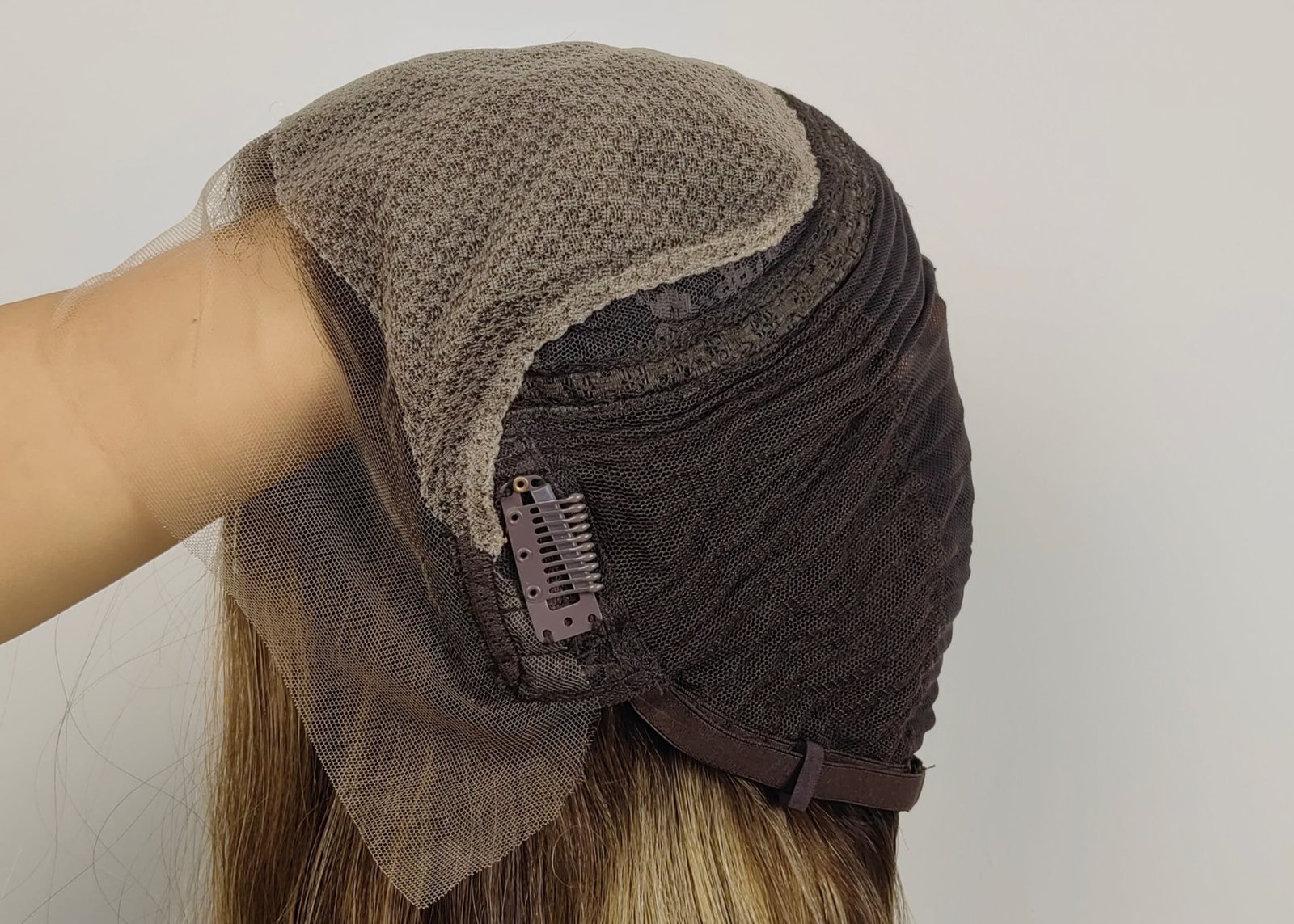 A detailed close-up of a lace front wig cap construction